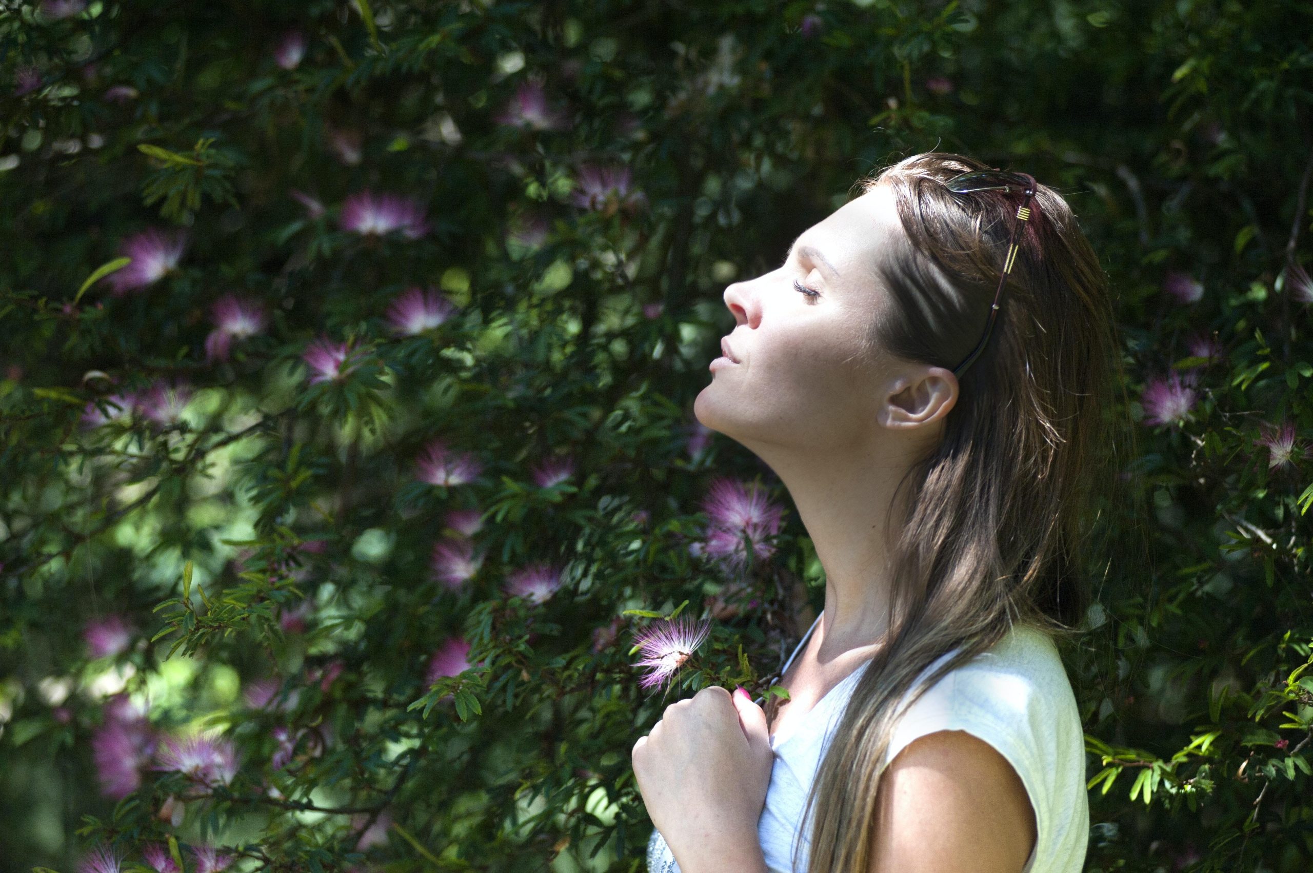 A person meditating in a peaceful outdoor setting